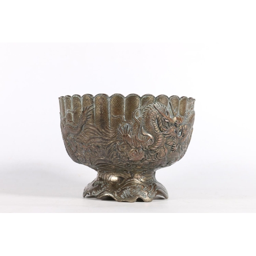 115 - Chinese bronzed metal bowl decorated with encircling dragons.