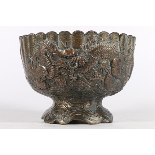 115 - Chinese bronzed metal bowl decorated with encircling dragons.