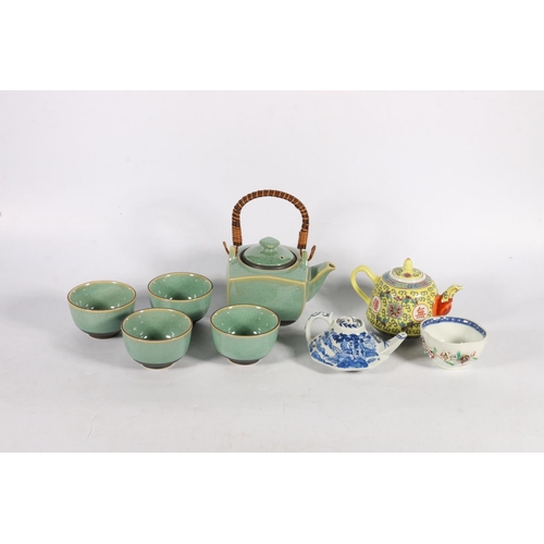 120 - Japanese celadon type glazed five tea piece teaset, a blue and white oriental teapot, another, and a... 