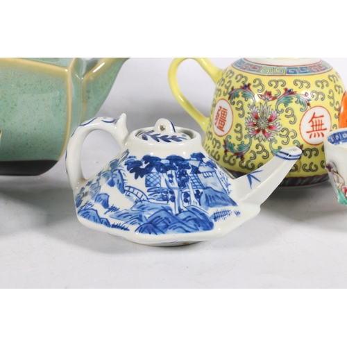 120 - Japanese celadon type glazed five tea piece teaset, a blue and white oriental teapot, another, and a... 