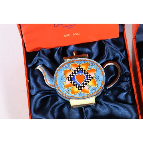 123 - Two Charlotte Di Vita limited edition enamelled teapots, both in original boxes.