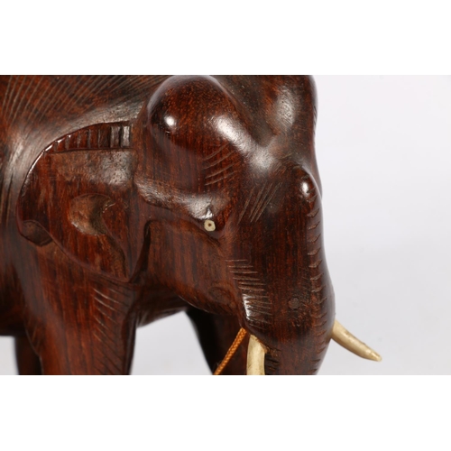 183A - Wooden sculpture of two elephants.