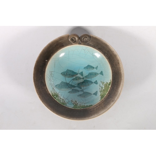 66 - Studio pottery bowl decorated to the centre with school of fish and seaweed. Indistinct stamp to bas... 