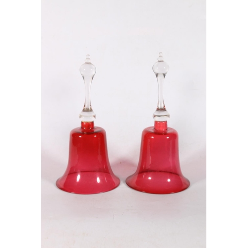 76 - Pair of Victorian cranberry glass bells, 26cm.