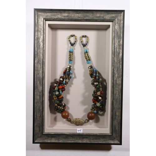 415 - AFRICAN SCHOOL, an elaborate hardstone, glass, seed and white metal necklace in box display frame, 7... 