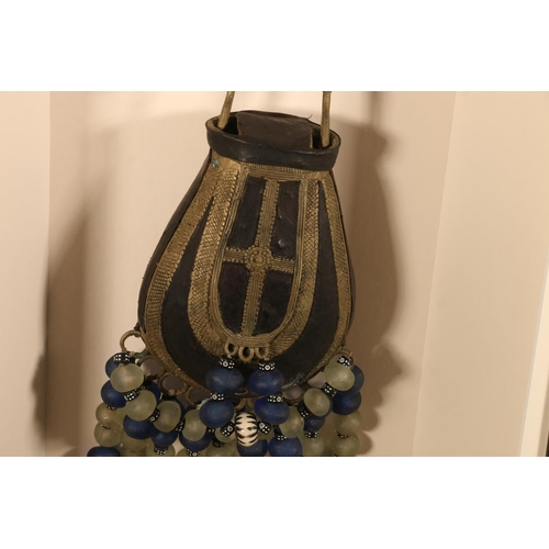 416 - AFRICAN SCHOOL, an elaborate hardstone, glass and metal necklace with leather pouch, in box display ... 