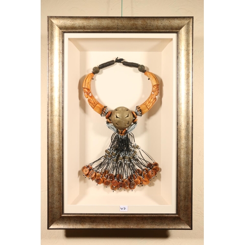 417 - AFRICAN SCHOOL, an elaborate metal and bead necklace, in box display frame, 84cm x 57cm.