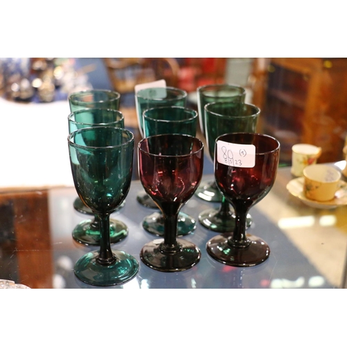 80 - Nine early 20th century wine glasses, seven in green and two in amethyst glass, 13cm (9)