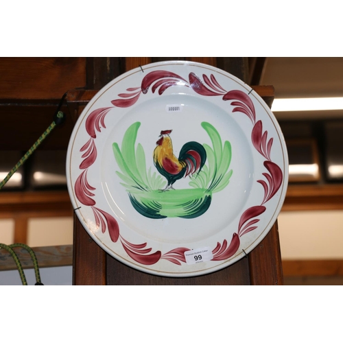 99 - French wall charger plate decorated with a cockerel in the Wemyss manner, 32cm diameter.