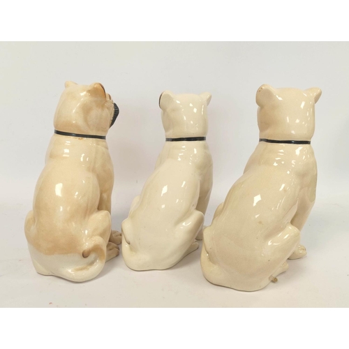 265 - Late 19th/early 20th century pair of Staffordshire style pottery figures modelled as seated pug dogs... 