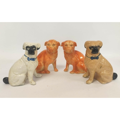 266 - Two early 20th century Staffordshire style ceramic figures modelled as seated pug dogs, with painted... 