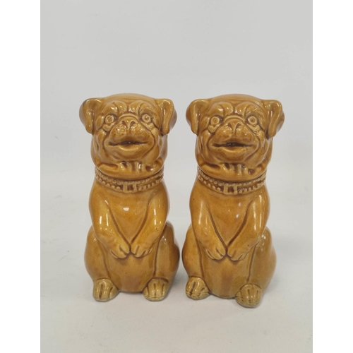 267 - Four early 20th century assorted ceramic pug, and similar, dog models, all in seated poses, to inclu... 