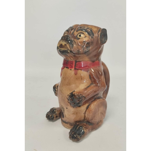 268 - 19th century continental majolica tobacco jar, modelled as a pug dog in seated pose, wearing red bow... 