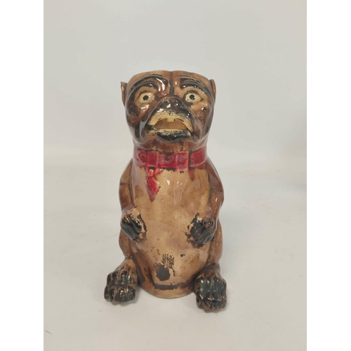 268 - 19th century continental majolica tobacco jar, modelled as a pug dog in seated pose, wearing red bow... 