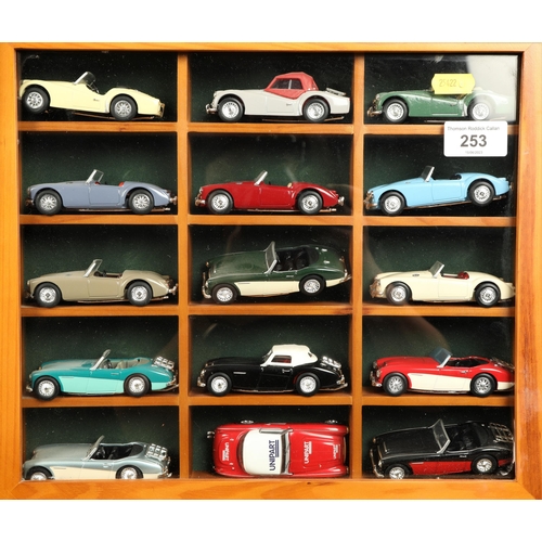 253 - Four wall mounted cabinets each containing fifteen cars to include sports cars, commercial vehicles ... 