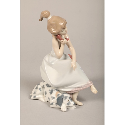 11 - Lladro figure of a girl on telephone with dog. 19 cm high