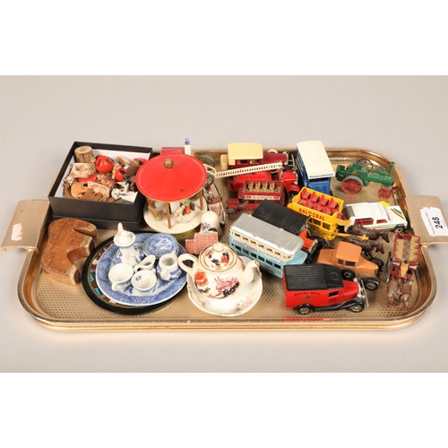 248 - Collection of model vehicles, miniature dolls part teasets etc