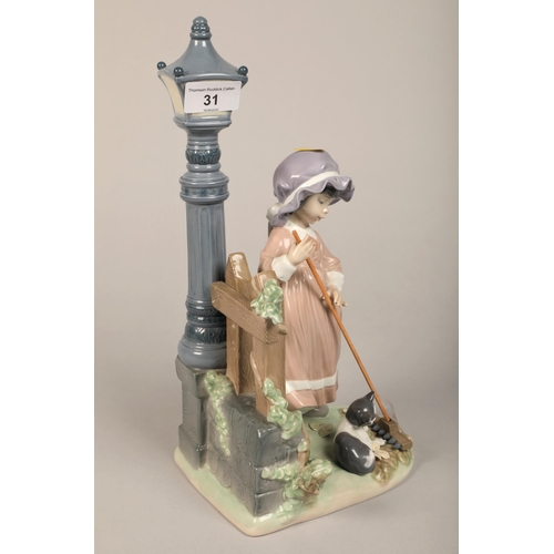 31 - Lladro figurine of girl with kitten and lamp post, 34 cm high
