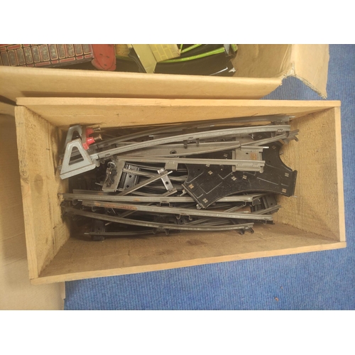 93 - Four boxes of model railway scenery and rolling stock to include 0 gauge track and Hornby transforme... 