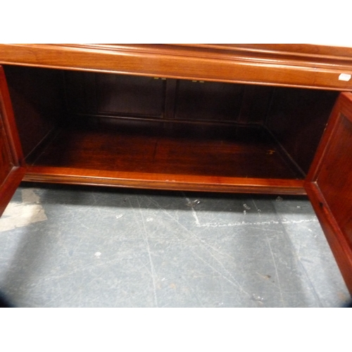 518 - Chinese-style cherry wood low cabinet fitted with central cupboards flanked by drawers.