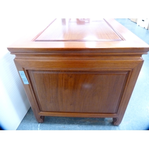 518 - Chinese-style cherry wood low cabinet fitted with central cupboards flanked by drawers.