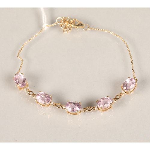 111 - Ladies 9ct gold  bracelet set with five pink stones