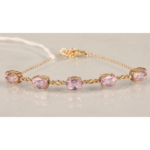 111 - Ladies 9ct gold  bracelet set with five pink stones