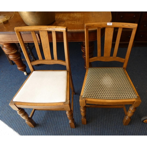 312 - Two oak dining chairs.