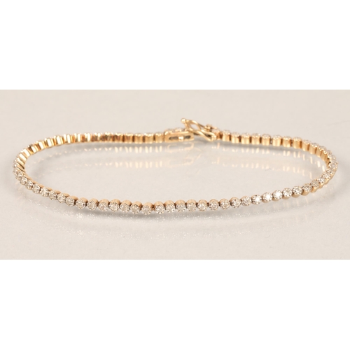 56 - 9ct  yellow gold diamond set tennis bracelet 19.5cm