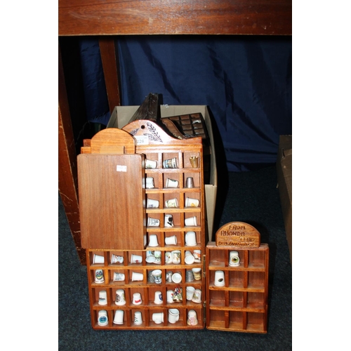 Box containing thimbles and thimble display cases.