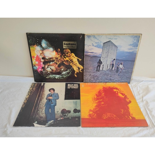 335B - Collection of 70s records to include The Who Who's Next, Santana Abraxas and two others. Also a firs... 