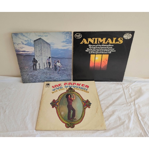 335B - Collection of 70s records to include The Who Who's Next, Santana Abraxas and two others. Also a firs... 