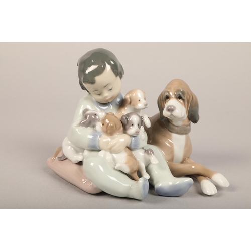 15 - Three Lladro figures of children and puppies