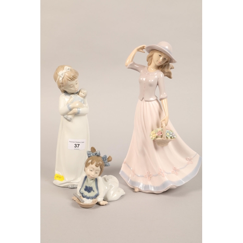 37 - Nao figure child with doll, another figure, and Leonardo figure