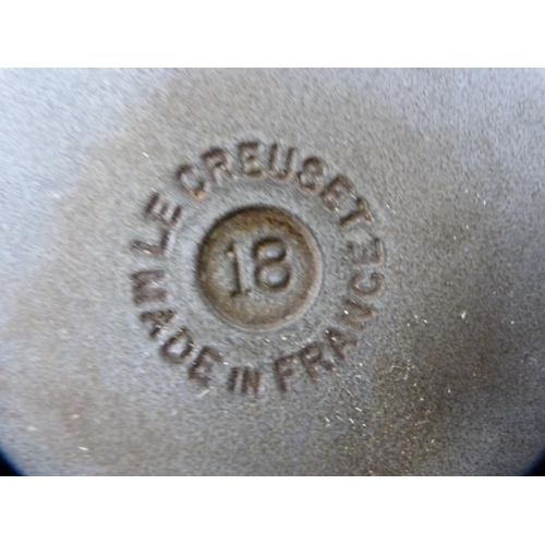 114 - Two Le Creuset pans with covers, glazed in blue, and a set of three Le Creuset graduated oven dishes... 