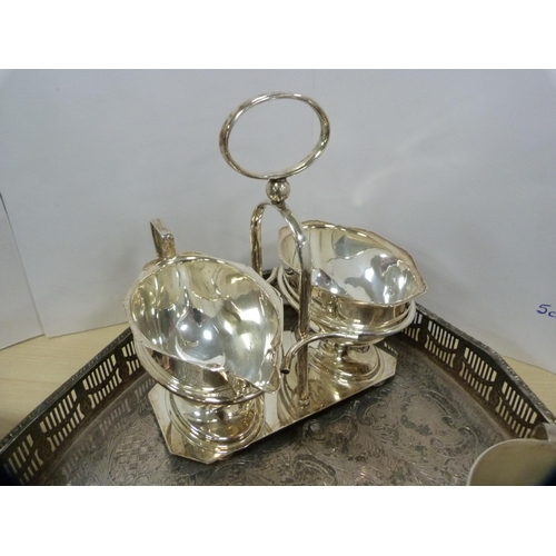 31 - Group of EP and plated wares to include an oval galleried tray, cream and sugar on stand, scalloped ... 