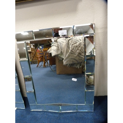 45 - Pair of unframed wall mirrors.