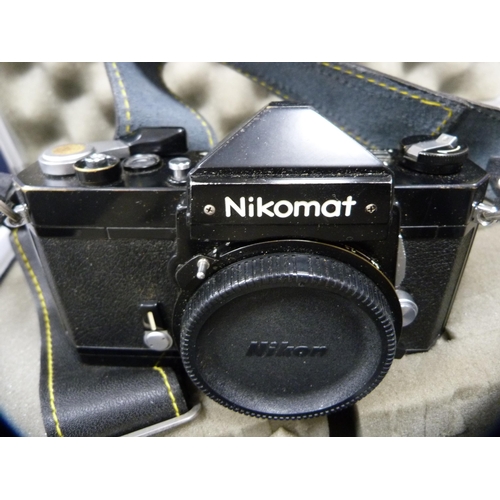 69 - Nikon Nikomat camera with flash and accessories, in fitted case.