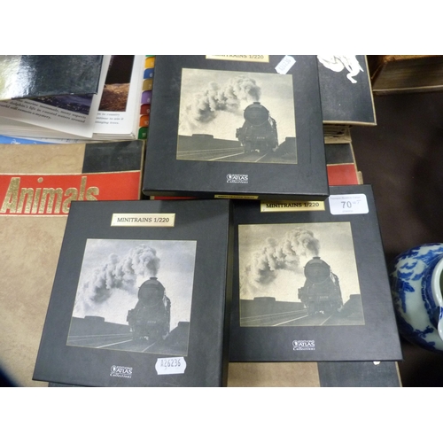 70 - Three boxes of Atlas model trains, boxed, and a collection of wildlife index fact files etc.