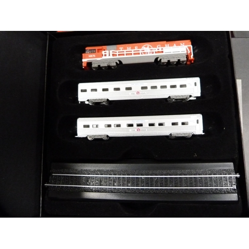 70 - Three boxes of Atlas model trains, boxed, and a collection of wildlife index fact files etc.