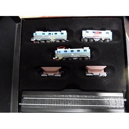 70 - Three boxes of Atlas model trains, boxed, and a collection of wildlife index fact files etc.