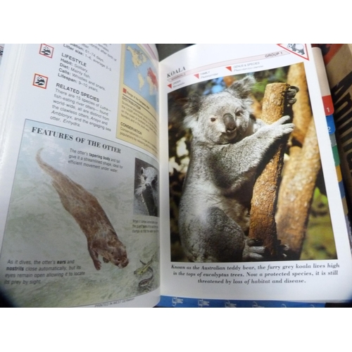 70 - Three boxes of Atlas model trains, boxed, and a collection of wildlife index fact files etc.