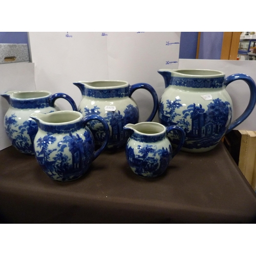 72 - Reproduction blue and white ceramic toilet ewer and basin, and a set of reproduction graduated jugs.