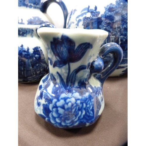 72 - Reproduction blue and white ceramic toilet ewer and basin, and a set of reproduction graduated jugs.
