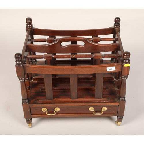 549 - Mahogany four section magazine rack with drawer on casters