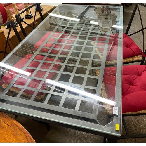 539 - Contemporary steel framed grid design glass topped dining table with four chairs 76cm h