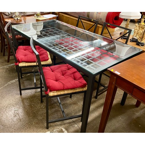 539 - Contemporary steel framed grid design glass topped dining table with four chairs 76cm h