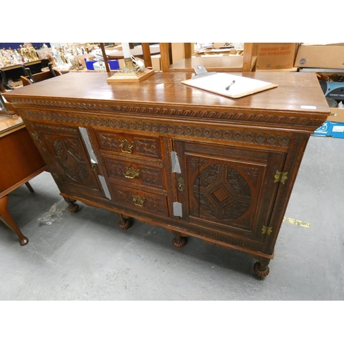 550 - Carved oak sideboard.