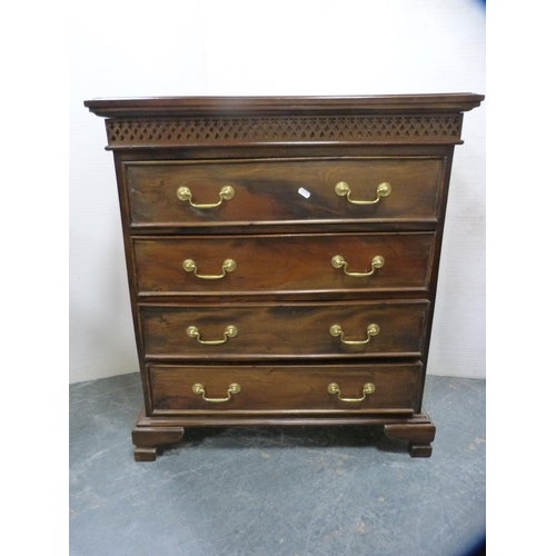 557 - Reproduction chest of four drawers on bracket feet.