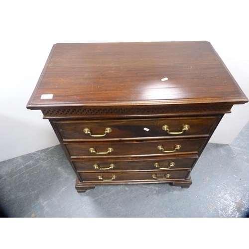 557 - Reproduction chest of four drawers on bracket feet.